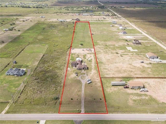 birds eye view of property featuring a rural view