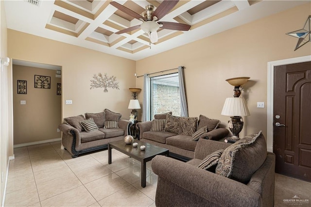 tiled living room with beam ceiling, ceiling fan, and coffered ceiling