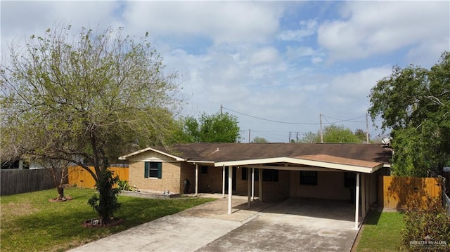 ranch-style home featuring brick siding, concrete driveway, a front yard, and fence