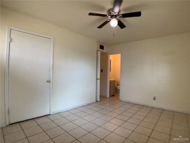 unfurnished bedroom with visible vents, baseboards, and light tile patterned flooring