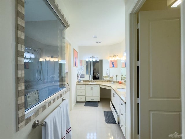 bathroom with tile patterned flooring and vanity