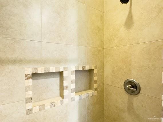 interior details with a shower