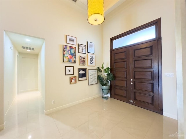 entrance foyer with light tile patterned floors