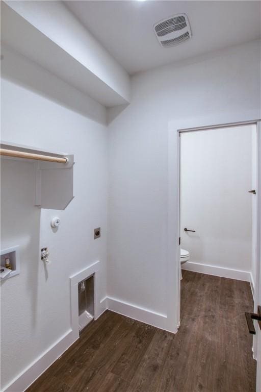 laundry area featuring hookup for a washing machine, dark hardwood / wood-style flooring, and electric dryer hookup