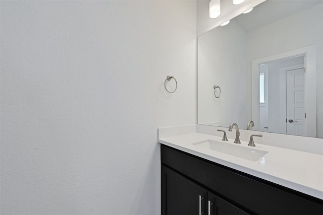 bathroom featuring vanity with extensive cabinet space