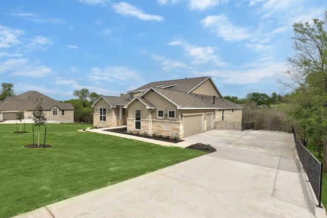 view of front of property with a front yard and a garage