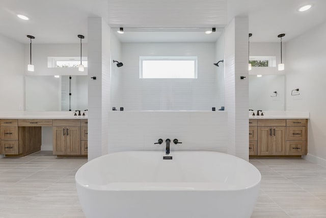 bathroom with double sink vanity and tile floors