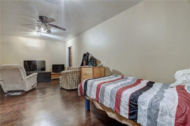 bedroom featuring ceiling fan and dark wood-type flooring