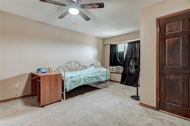 bedroom featuring light carpet and ceiling fan