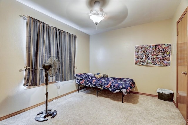 sitting room featuring light colored carpet and ceiling fan