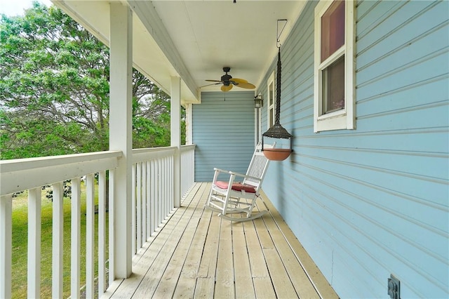 wooden deck with ceiling fan