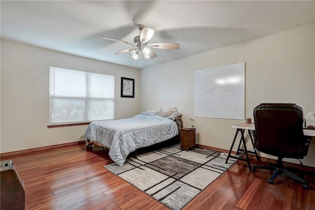 bedroom with ceiling fan and light hardwood / wood-style flooring