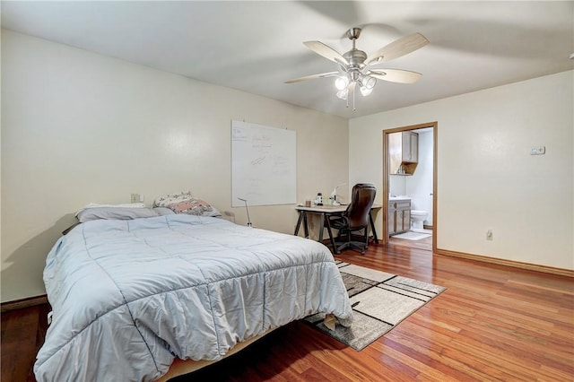 bedroom featuring ceiling fan, connected bathroom, and wood-type flooring