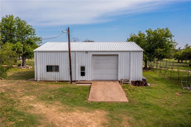 garage featuring a yard