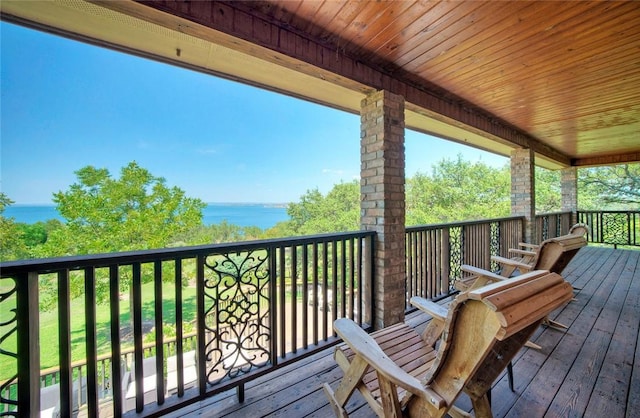 deck featuring a water view