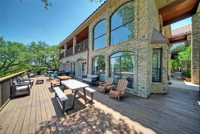 deck featuring outdoor lounge area