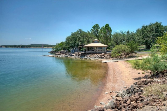 view of dock featuring a water view and a gazebo