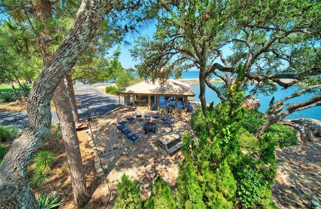 exterior space with a water view and a gazebo