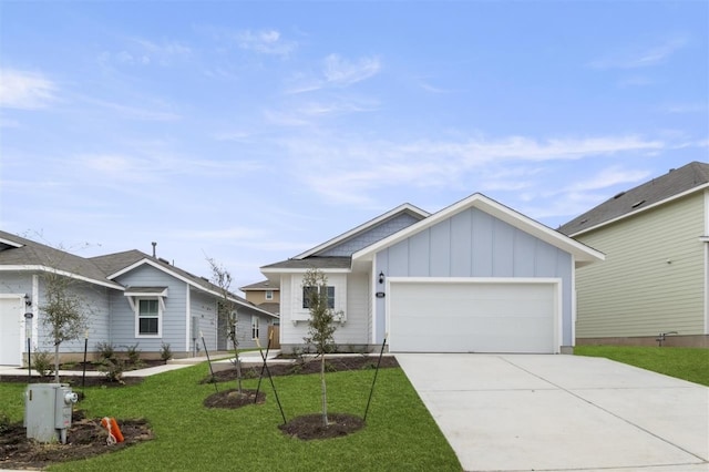 view of front of property with a garage and a front yard