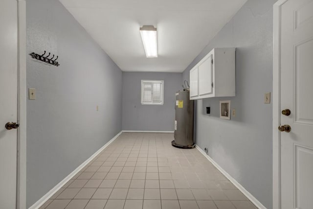 laundry room featuring light tile floors, electric water heater, and hookup for a washing machine