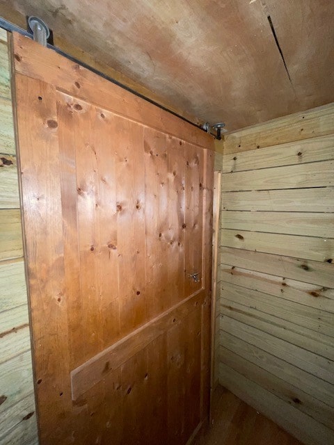 interior space featuring wood walls