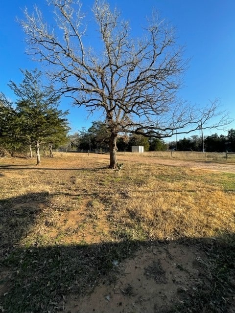 view of yard with a rural view