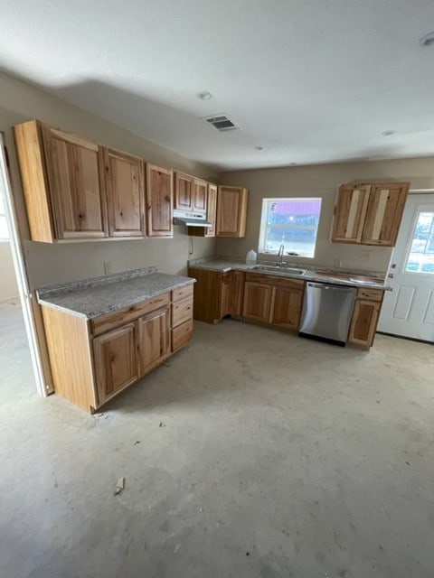 kitchen with stainless steel dishwasher, sink, and light stone countertops