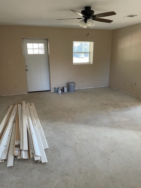 spare room with a healthy amount of sunlight and ceiling fan