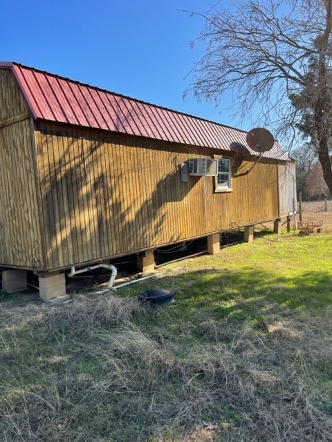 view of home's exterior with a lawn