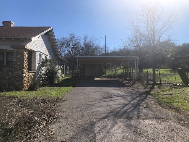 view of side of property featuring a carport