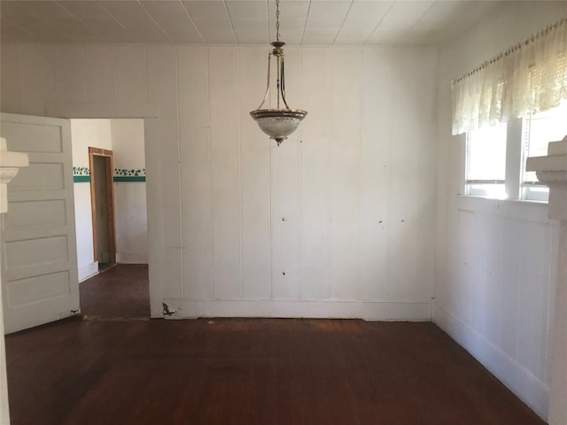 spare room featuring dark hardwood / wood-style floors