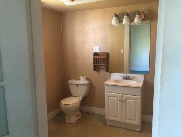 bathroom with toilet and vanity