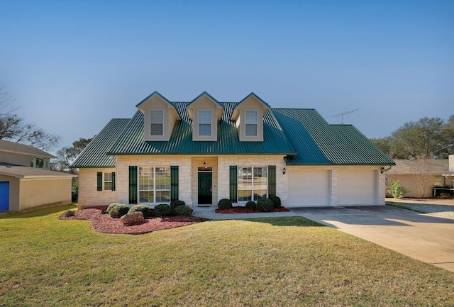 view of front of property with a front lawn and a garage