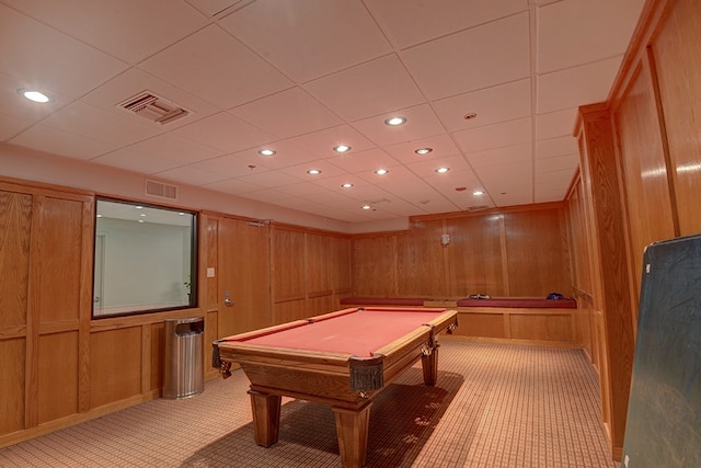 recreation room featuring a drop ceiling, wood walls, light colored carpet, and pool table