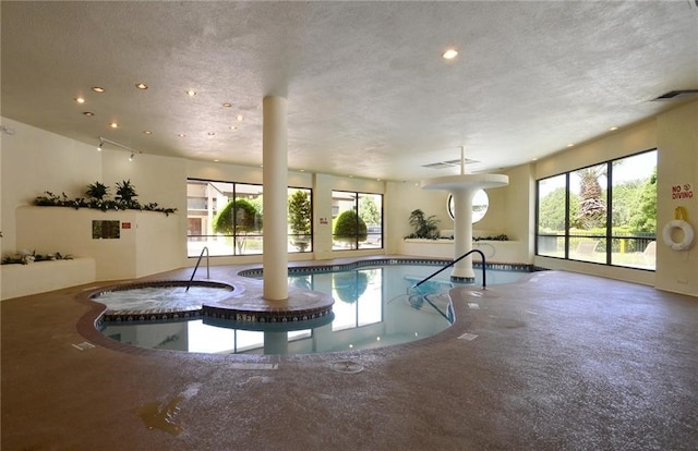 view of pool with an indoor in ground hot tub