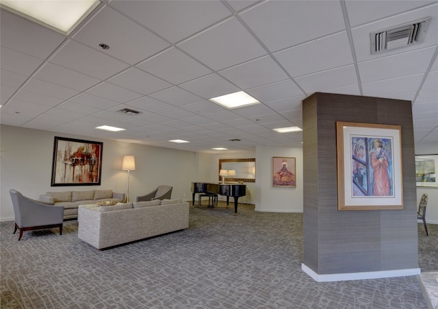 living room featuring a paneled ceiling and carpet floors