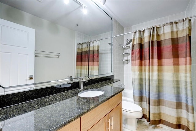 full bathroom featuring oversized vanity, toilet, and shower / tub combo with curtain