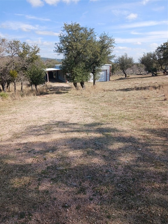 view of yard with a rural view