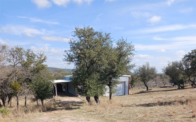 exterior space with a rural view