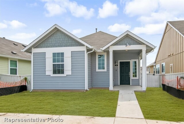 view of front of home featuring a front yard