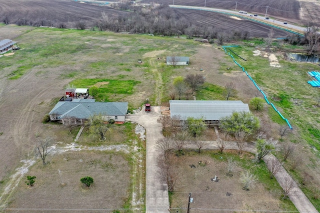 birds eye view of property with a rural view