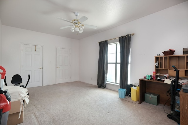 carpeted home office with ceiling fan