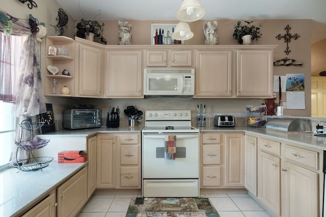 kitchen featuring decorative light fixtures, white appliances, light tile flooring, and light stone countertops