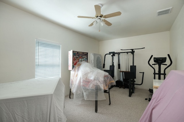 bedroom featuring ceiling fan and light colored carpet