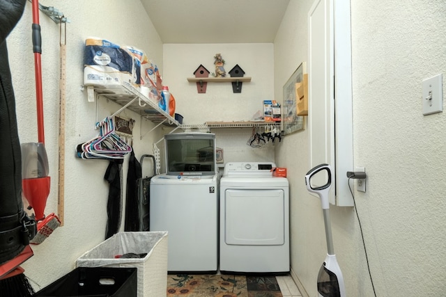 laundry area with washing machine and clothes dryer