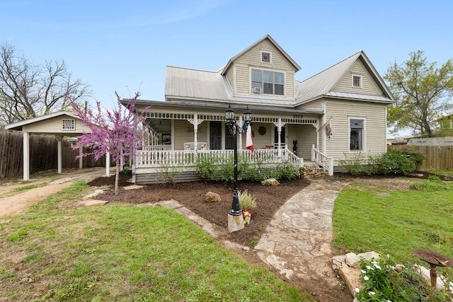 view of front of property featuring covered porch and a front yard