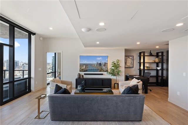 living room with light hardwood / wood-style flooring