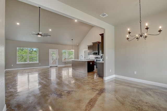 unfurnished living room featuring sink, high vaulted ceiling, and ceiling fan with notable chandelier