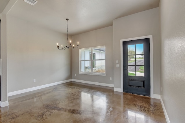 foyer entrance with a notable chandelier