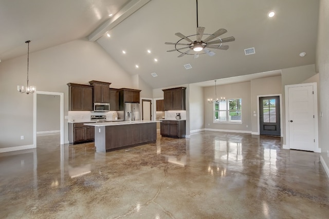 kitchen featuring an island with sink, decorative light fixtures, high vaulted ceiling, beamed ceiling, and appliances with stainless steel finishes